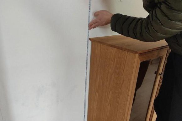 Measuring for a kitchen cabinet